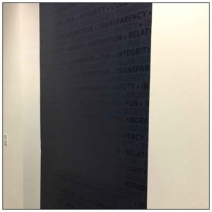 corporate value printed graphics along interior wall